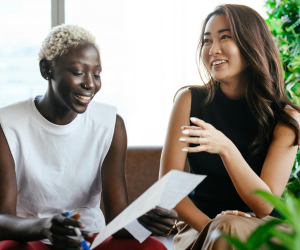 Two women discussing career tips.