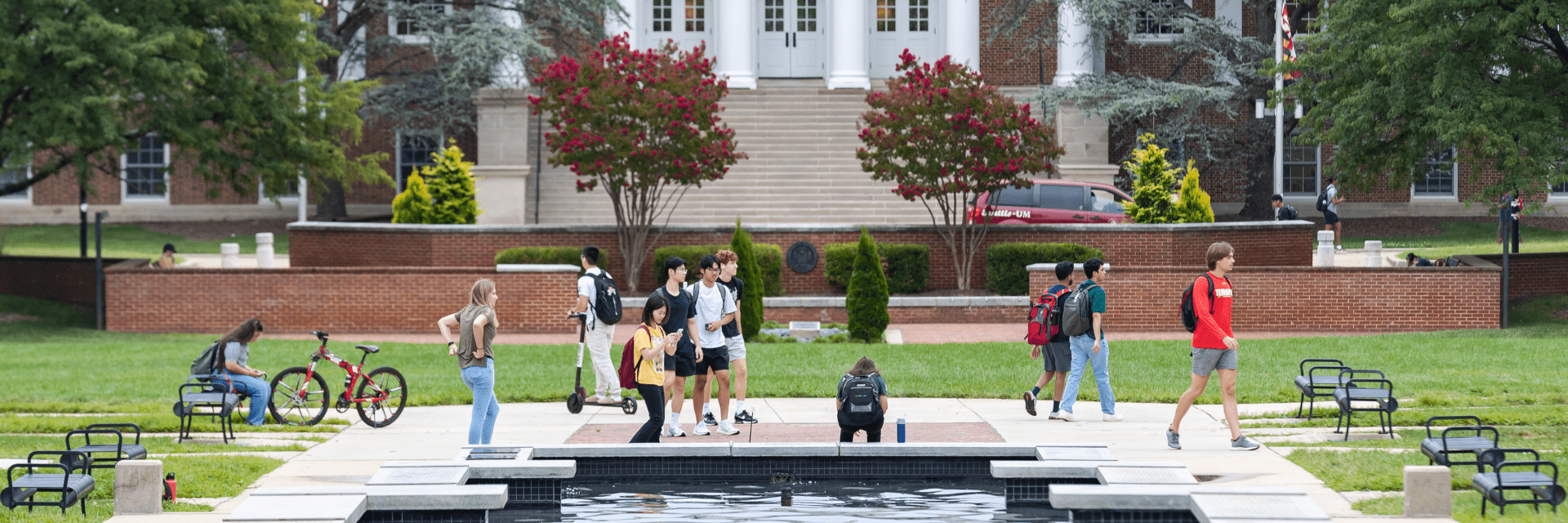 A photo of the UMD campus with students going about their day.
