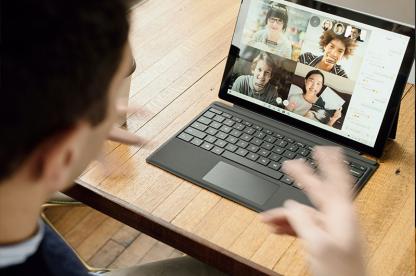 Man talking on Zoom call and laptop