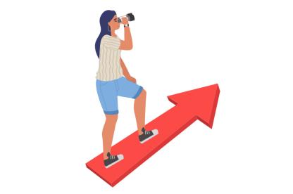 A woman standing on an arrow looking through binoculars. 